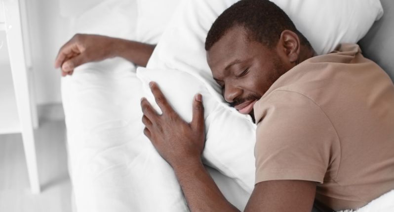 Man sleeping in a T-shirt