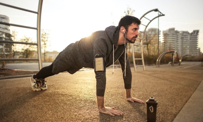 man doing push ups outside