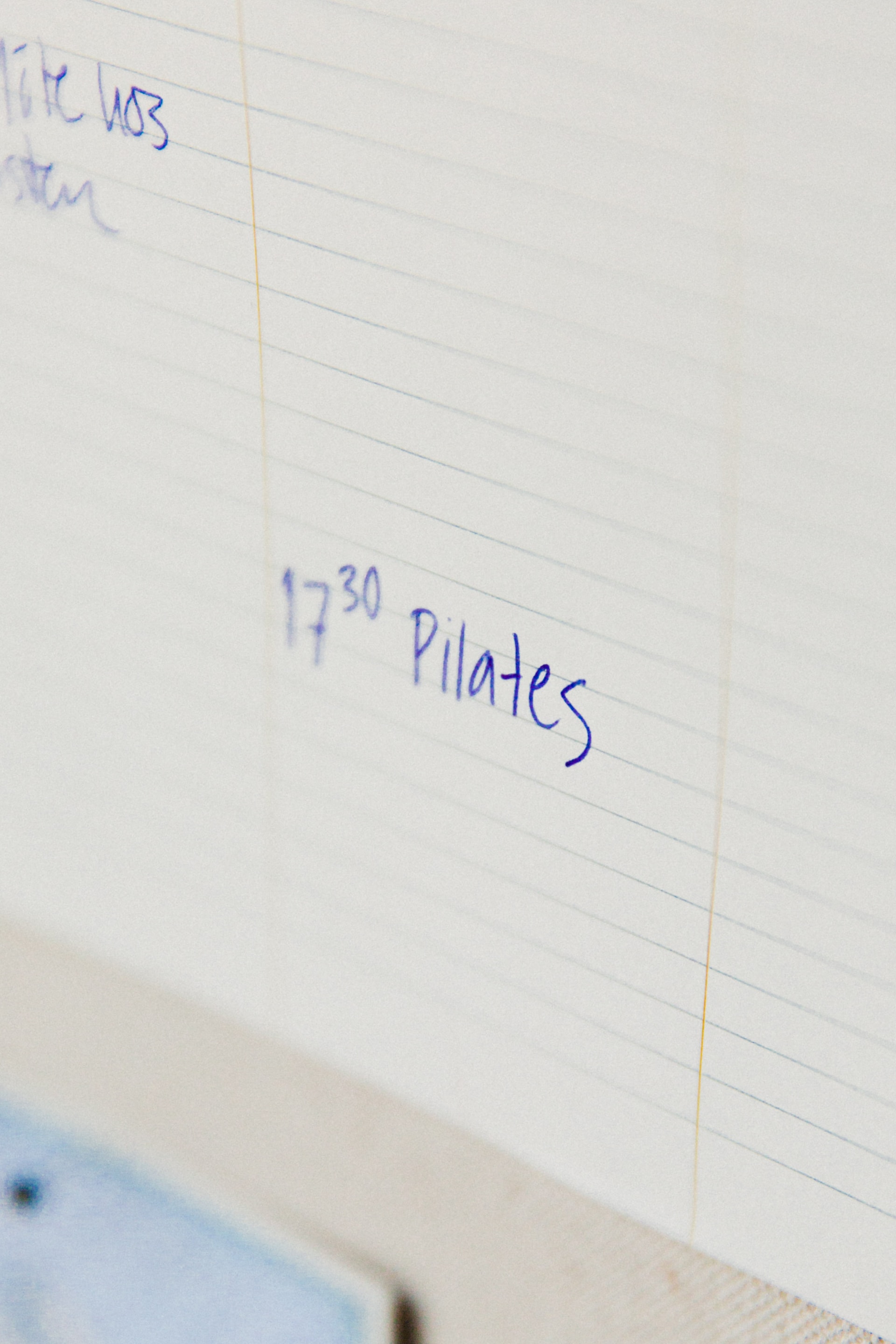notepad with pen written pilates 17 30