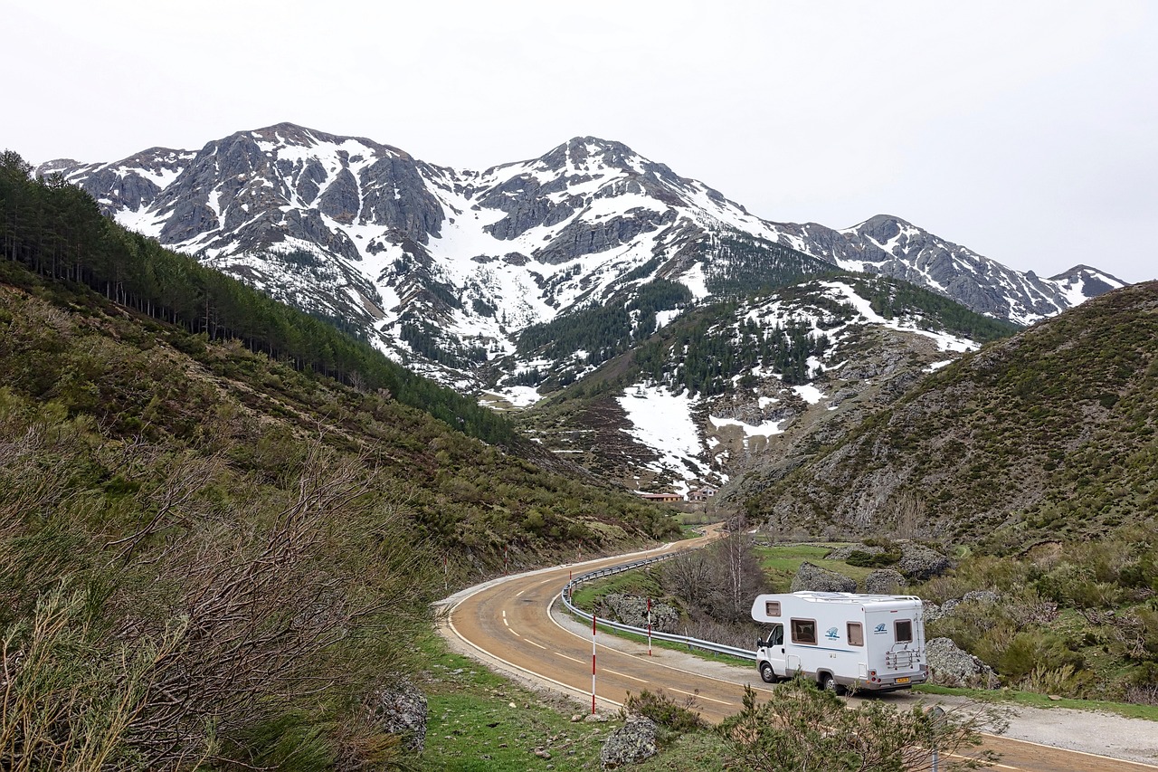 An RV driving through the mountains