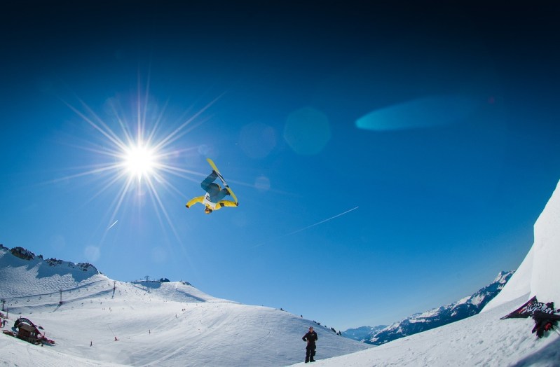 Snowboarder on large park jump