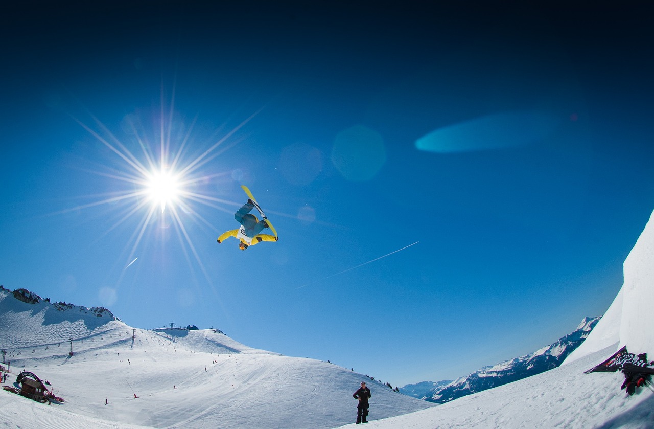 Snowboarder on large park jump