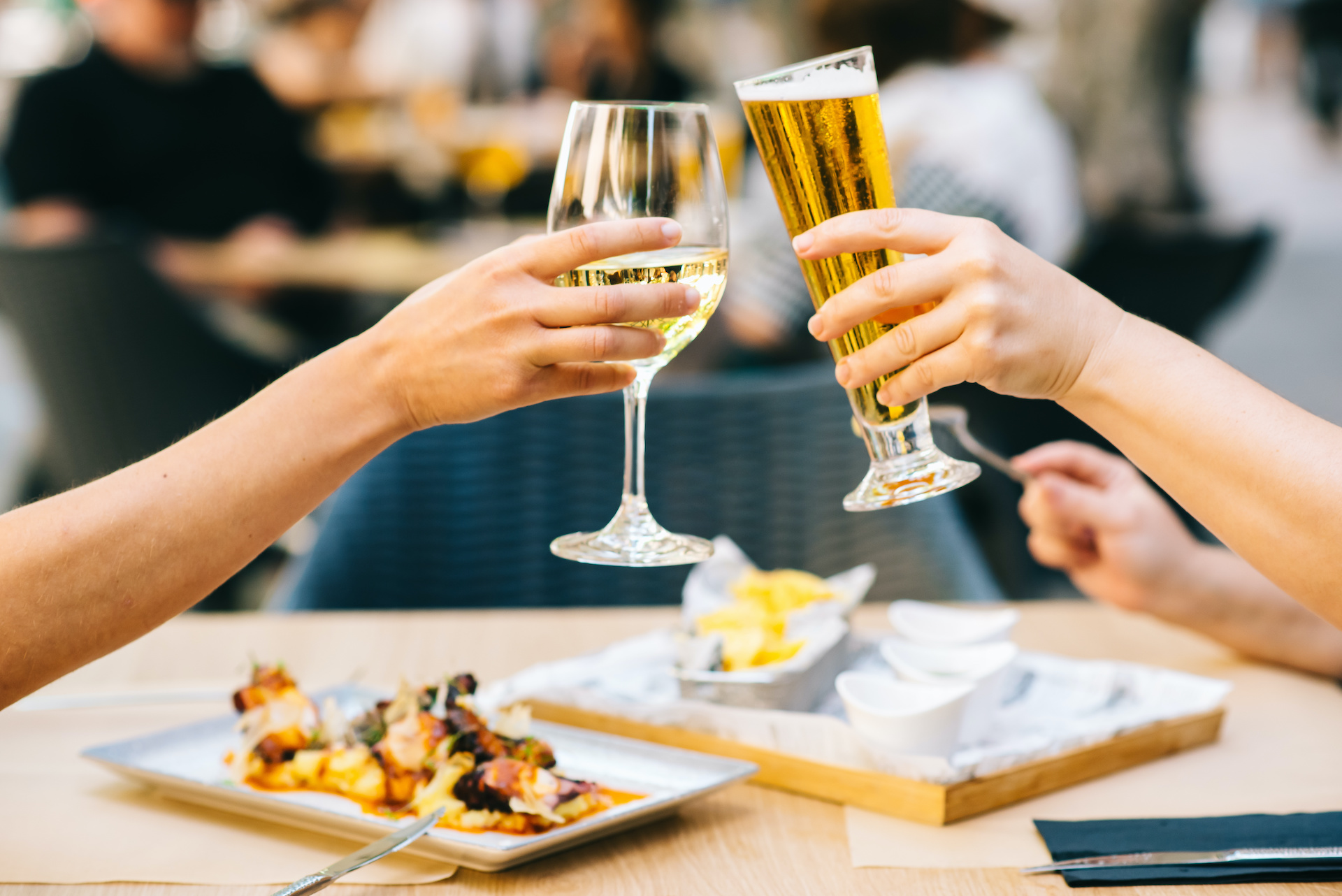 People toasting over plates