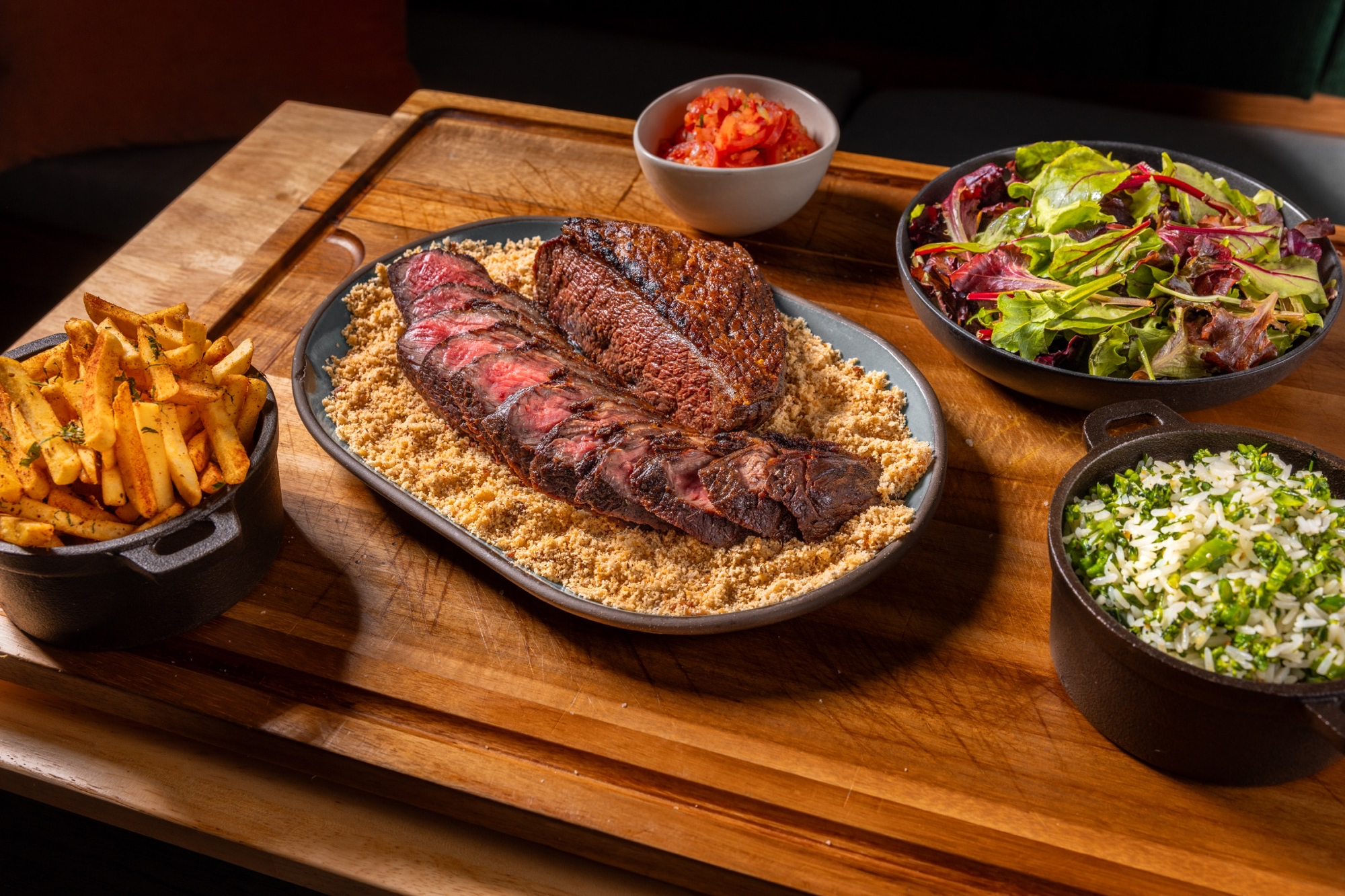 Brazilian picanha on plate with sides.