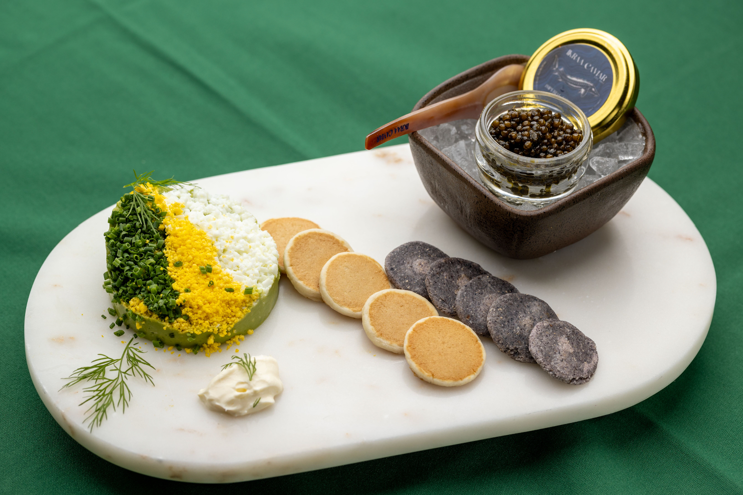 Caviar guacmole on white plate