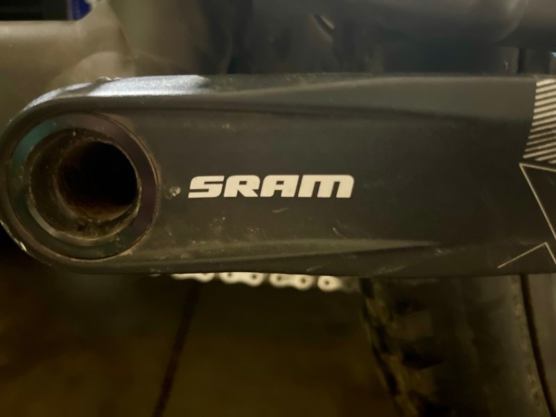 A SRAM brand crank arm on a mountain bike