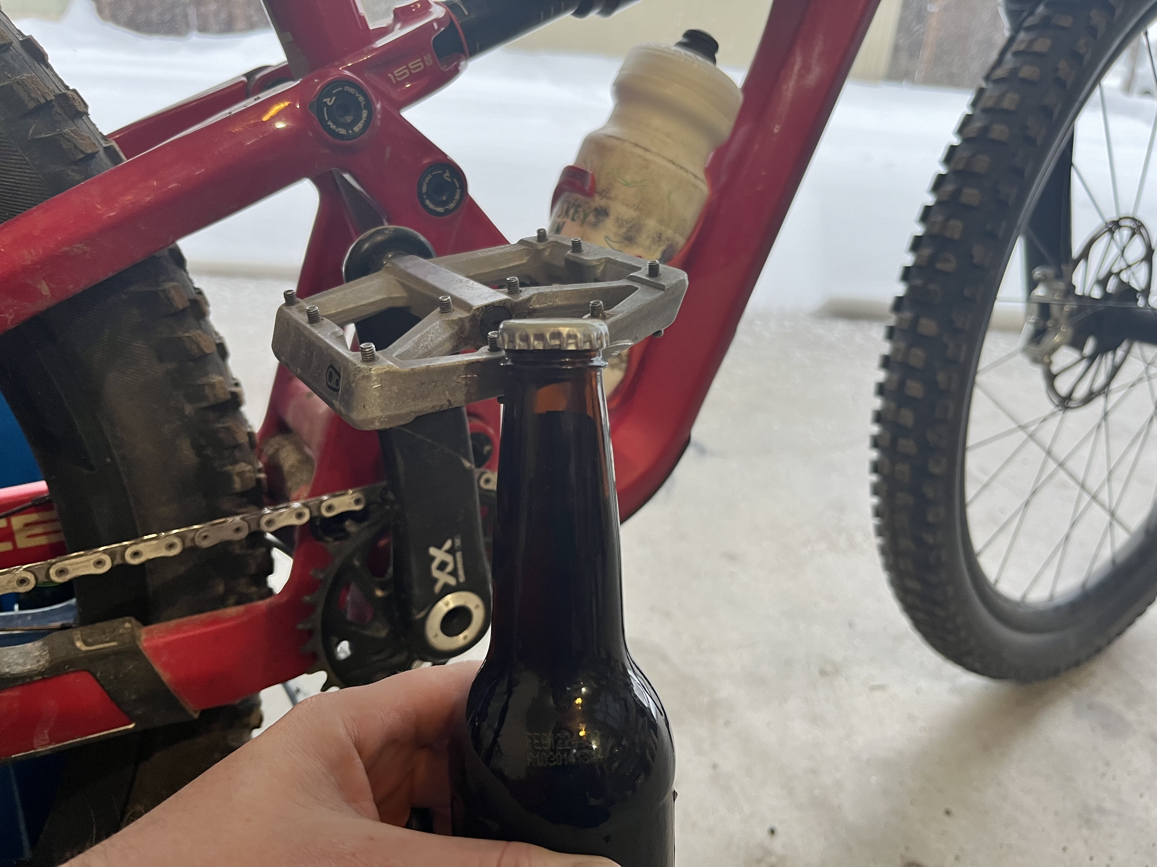 Using a mountain bike pedal to pop a beer cap off