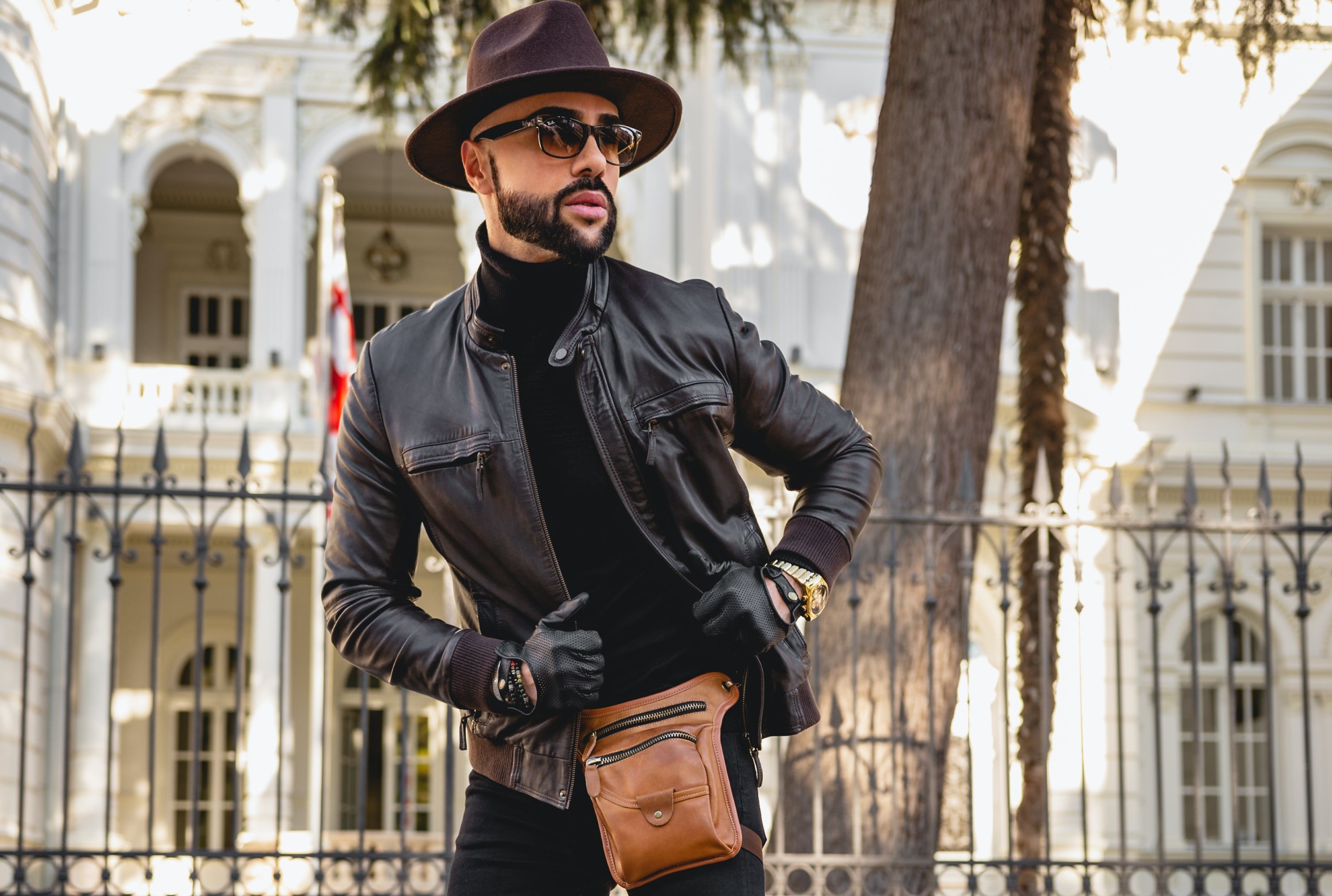 Man in hat, gloves, and bag