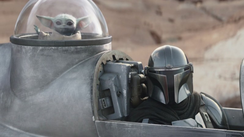 Grogu and The Mandalorian in a scene from season 3 of The Mandalorian.