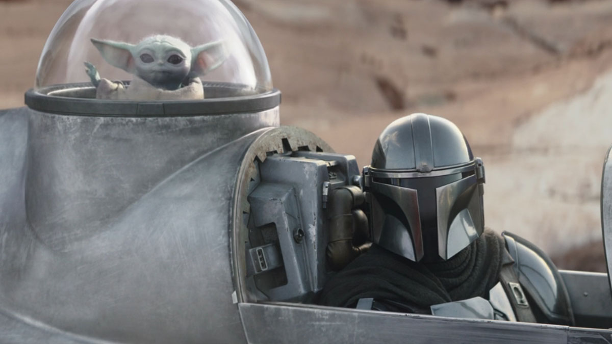 Grogu and The Mandalorian in a scene from season 3 of The Mandalorian.