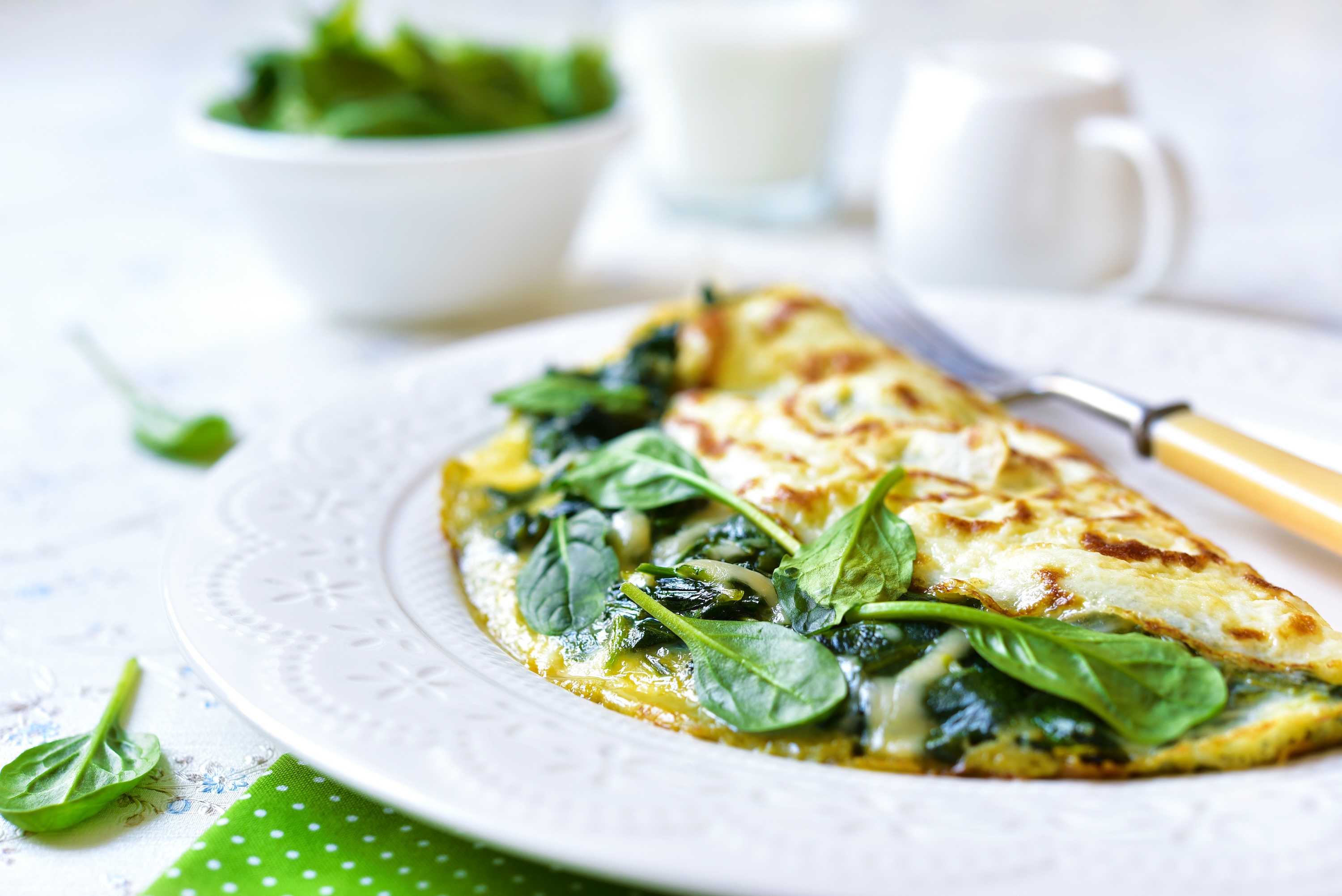 Omelet stuffed with spinach and cheese for a breakfast