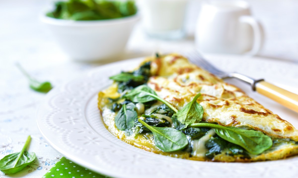 Omelet stuffed with spinach and cheese for a breakfast