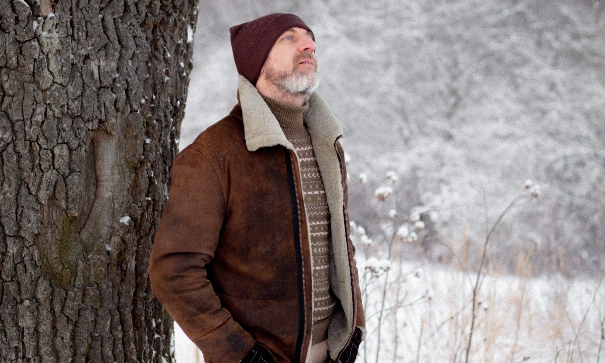 Man in suede coat in the snow