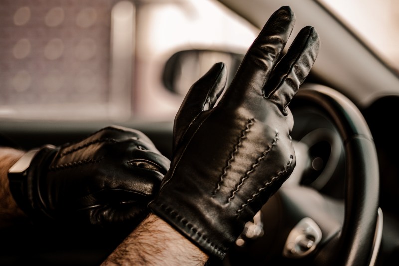 man wearing driving gloves