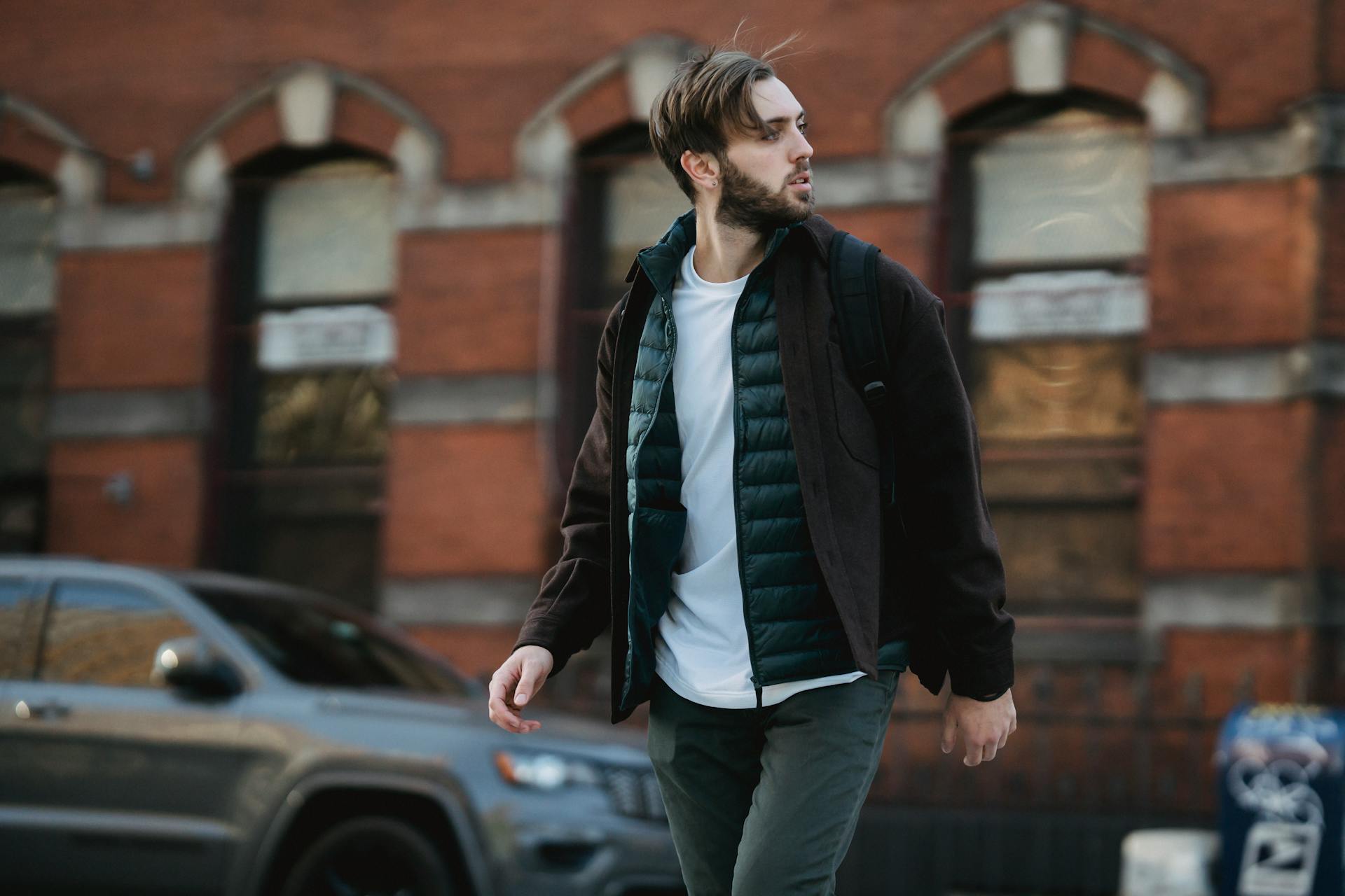 man wearing puffer vest with jacket