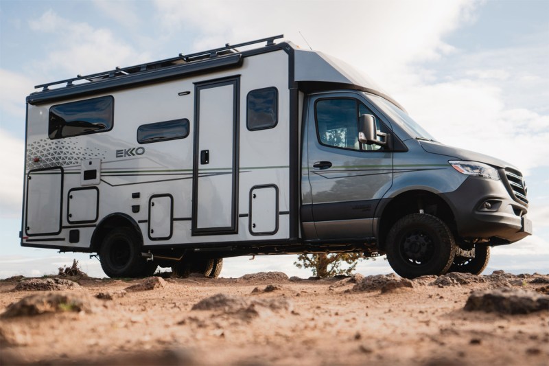 Winnebago Ekko Sprinter Campervan parked on a sandy ridge.