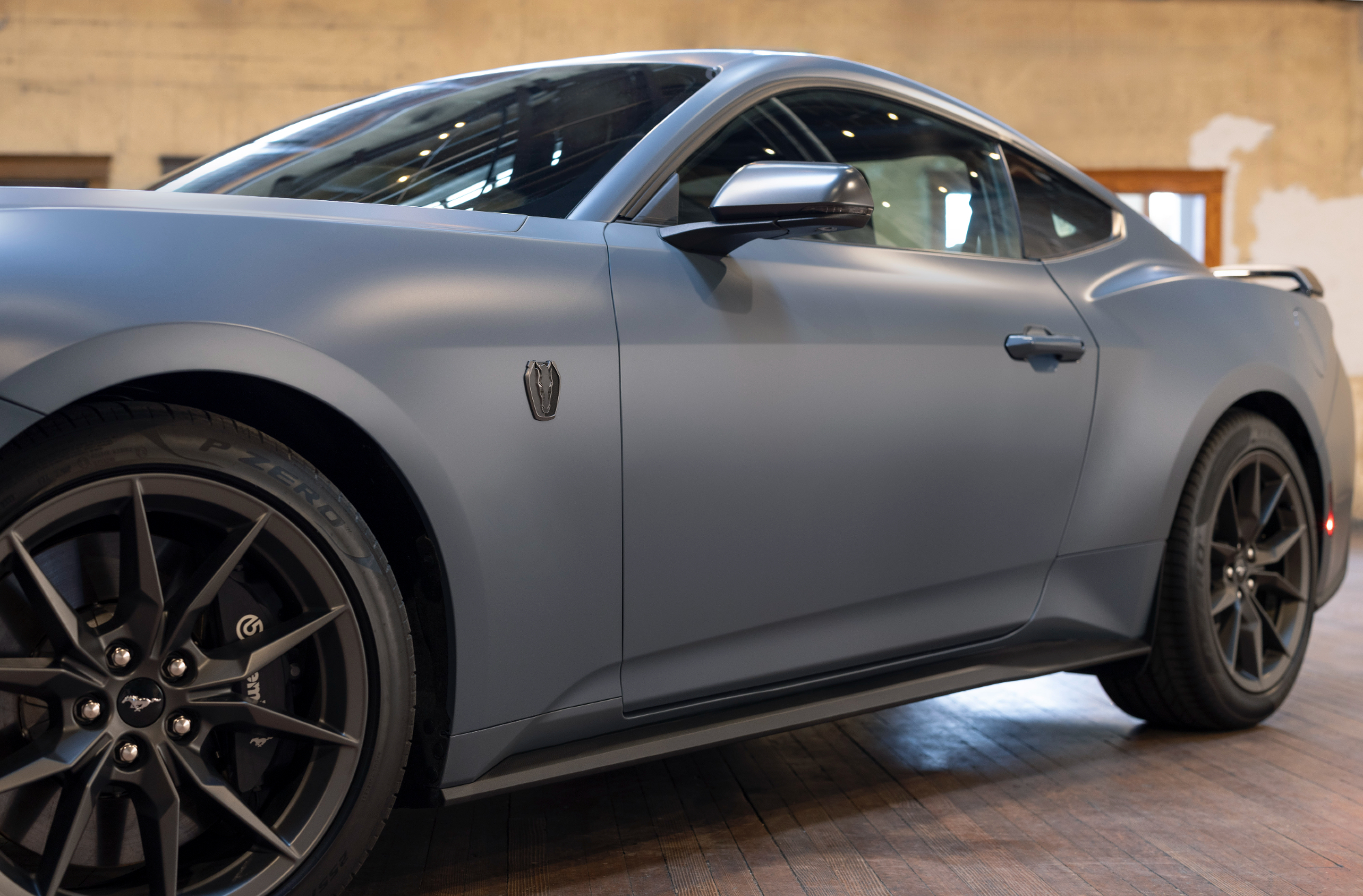 2024 Ford Mustang with Matte Clear Film close view of the left front quarter panel.