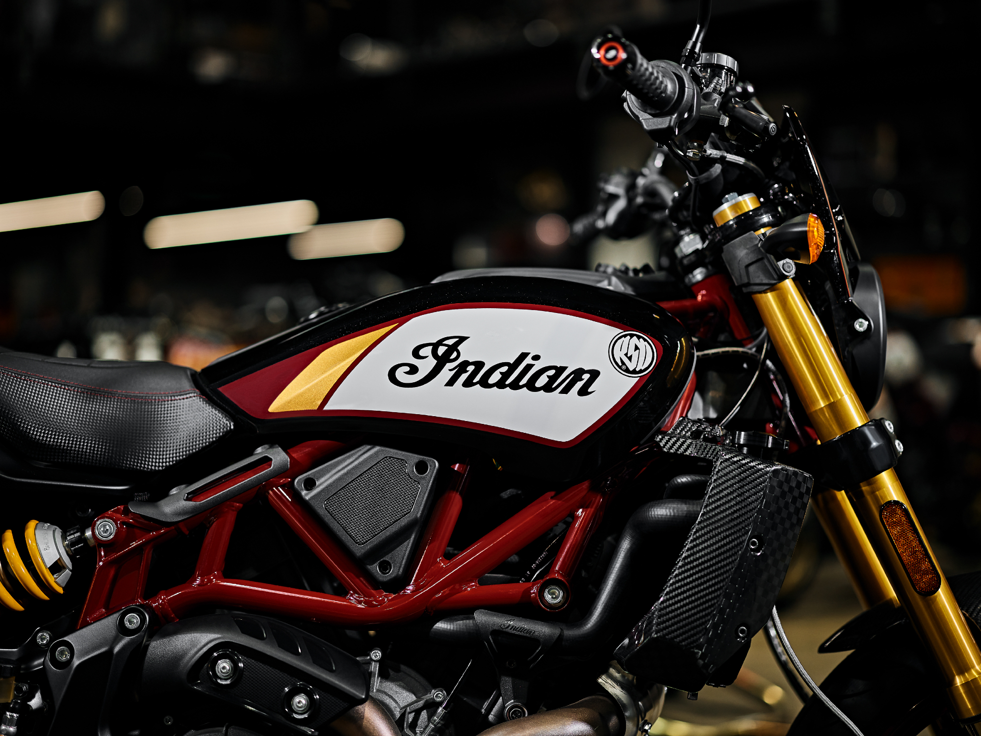 2024 Indian FTR x RSD Super Hooligan close view of the right side of the engine, exhaust, frame, and seat.