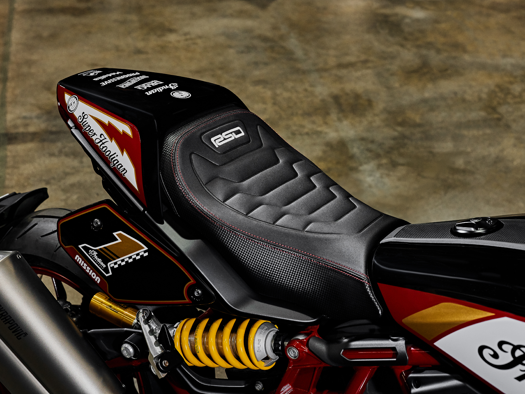 2024 Indian FTR x RSD Super Hooligan close view of the right side of the seat and rear shock suspension.