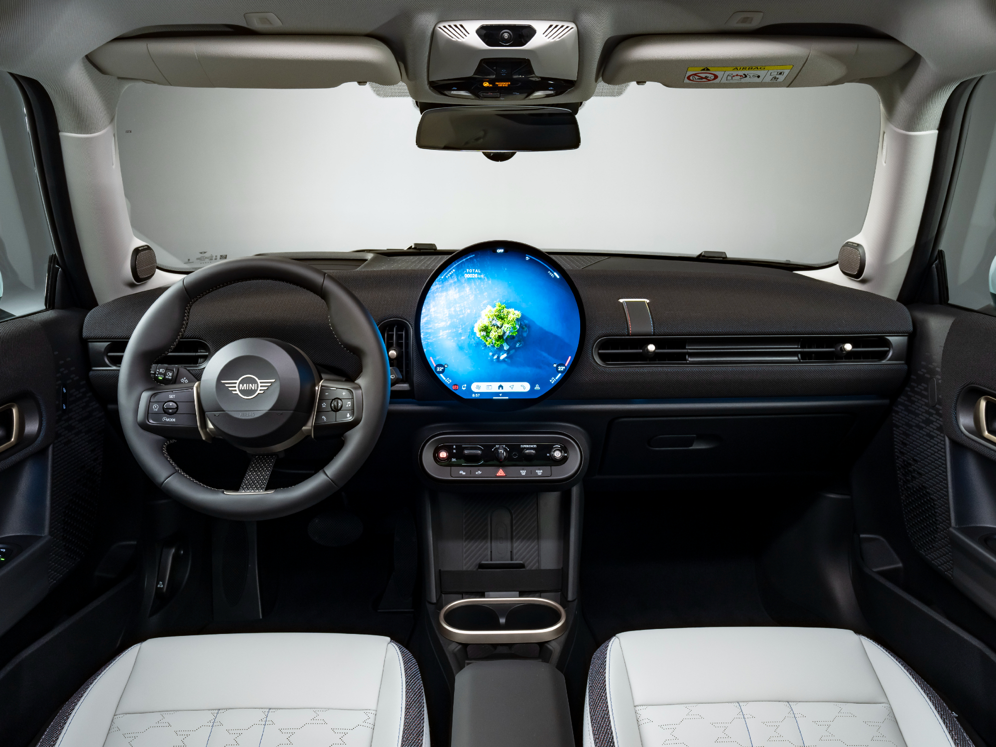 fifth generation mini cooper 2025 s interior front seats and dash with huge spherical display
