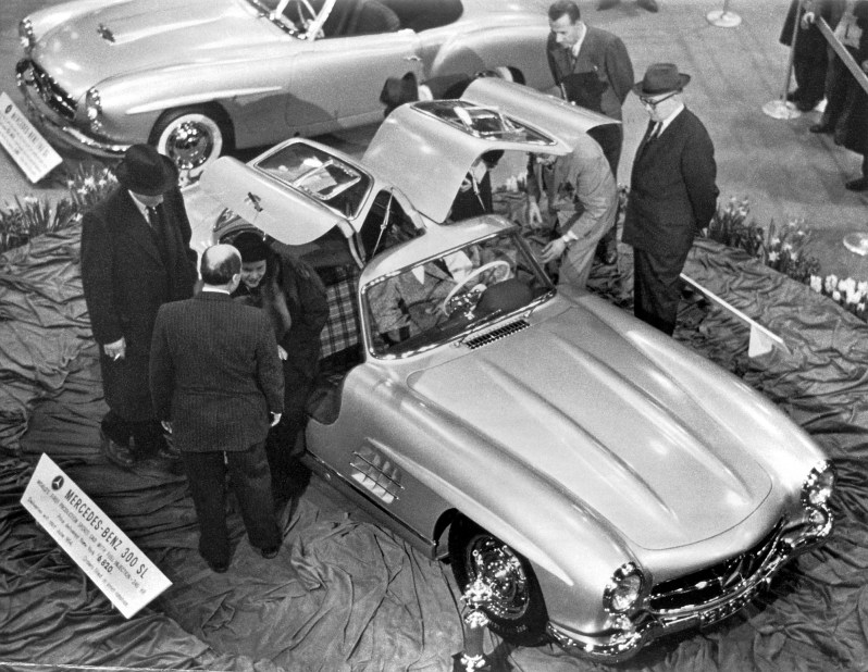 A crowd of people looking at the Mercedes-Benz 300 SL Couple gullwing at The International Motor Sports Show in New York on February 6, 1954.