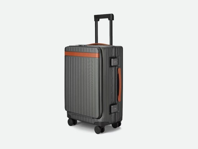 Carl Friedrik The Carry-On Pro, standing up with its handle extended.