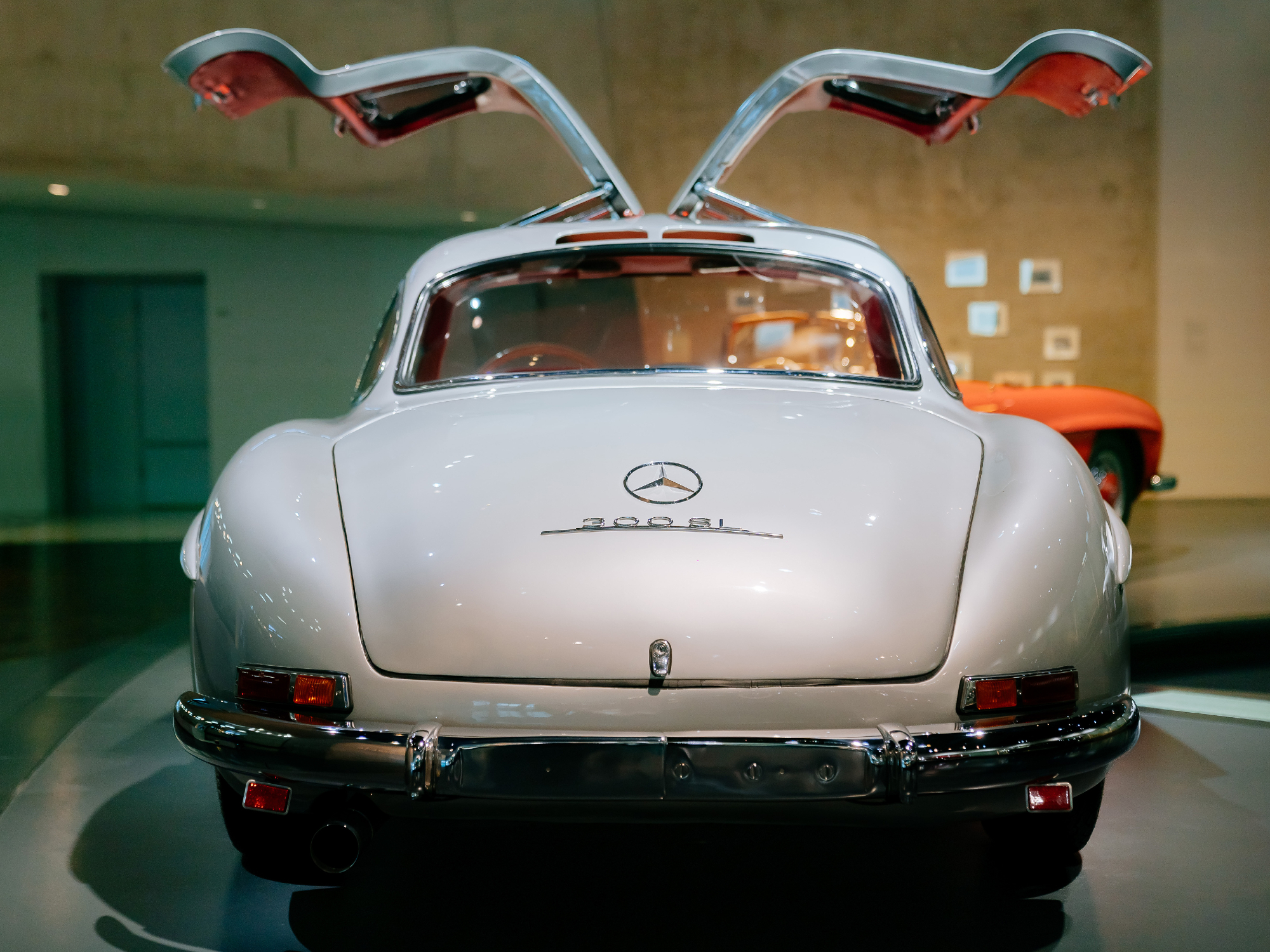 Mercedes-Benz 300 SL Coupe on display at the Mercedes-Benz Museum view from the back of the car with gullwing doors open