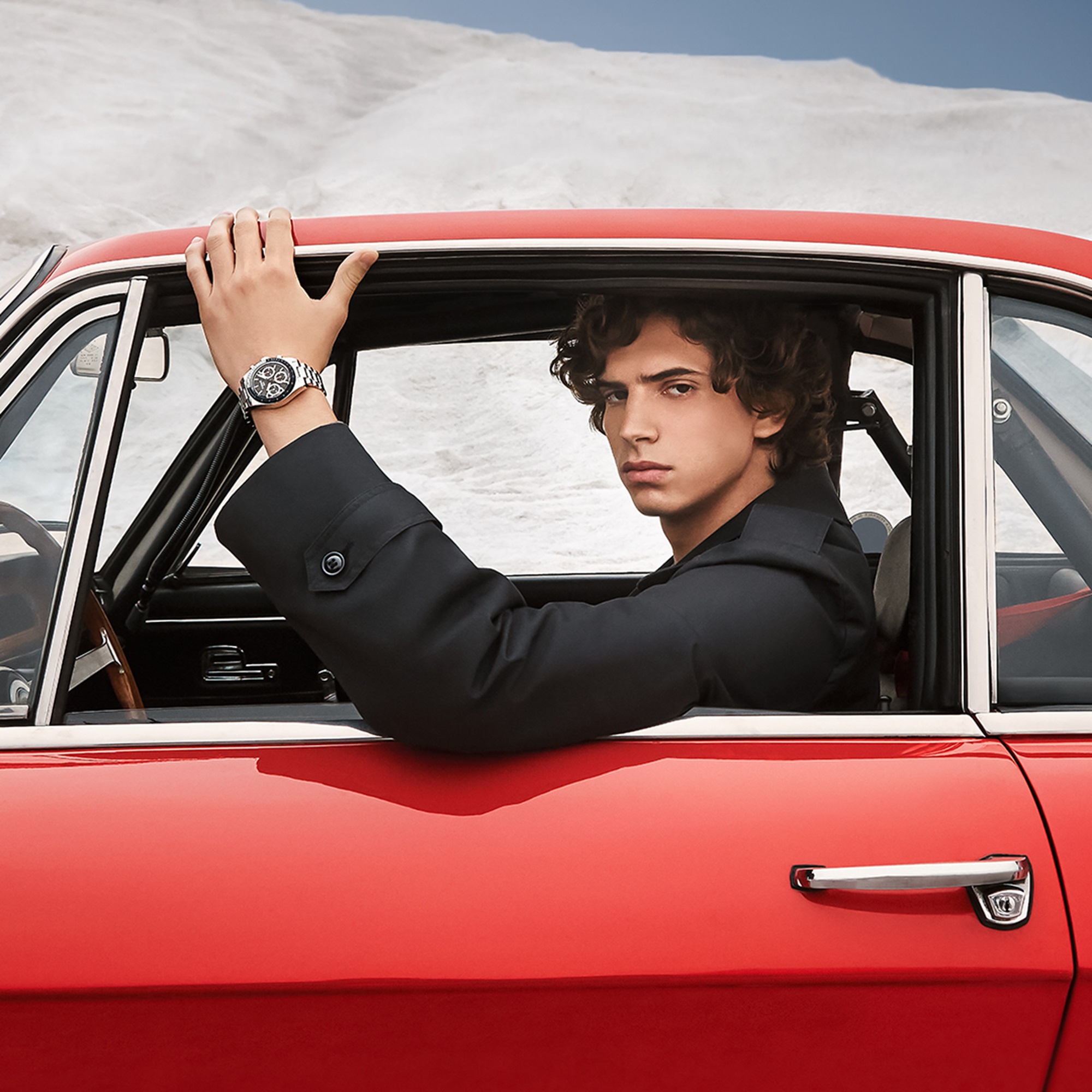 Tissot PR516 on model in red car