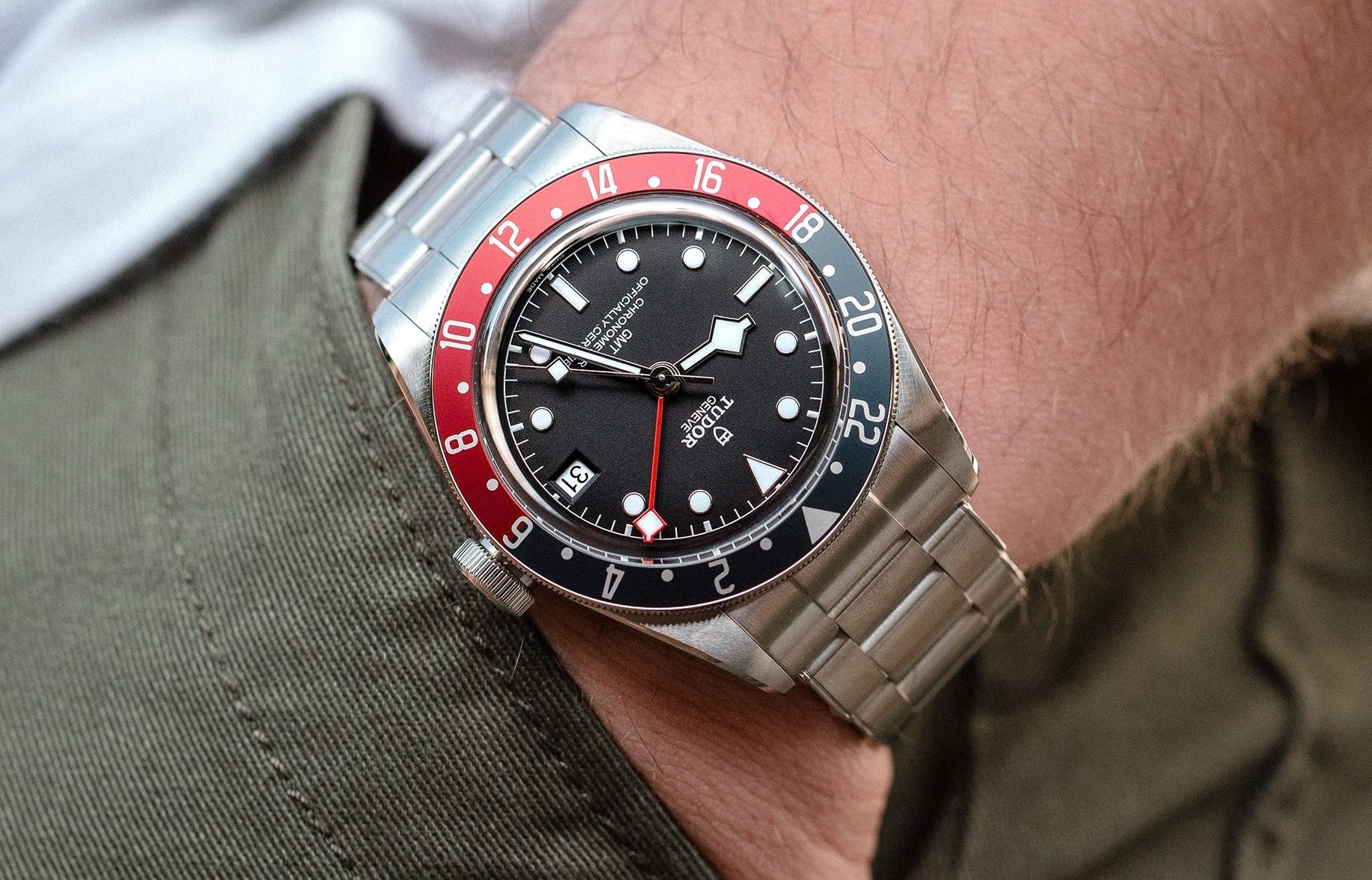 A man wearing a Tudor Black Bay GMT watch.