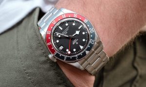 A man wearing a Tudor Black Bay GMT watch.