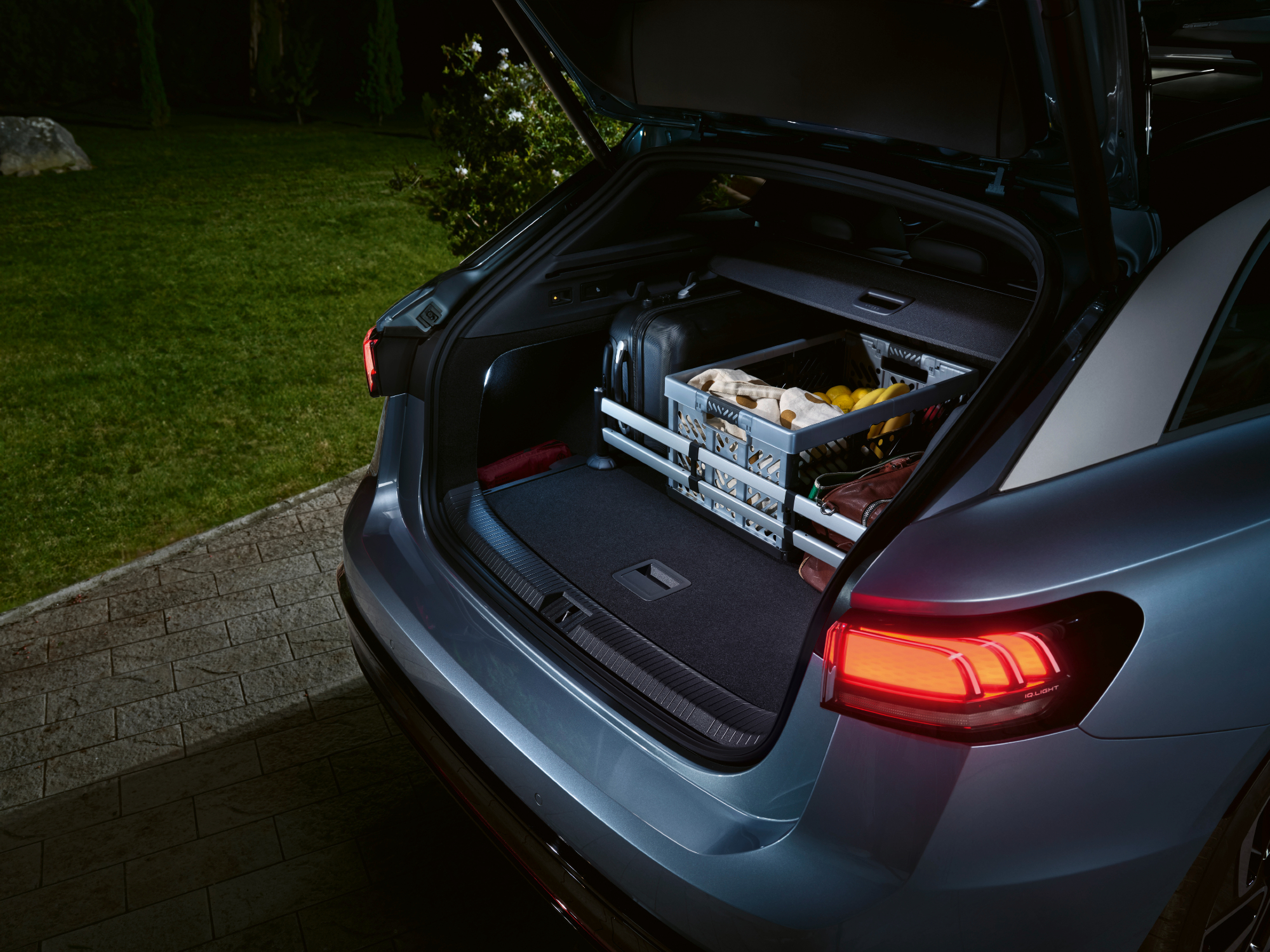 VW ID.7 concept side view of rear cargo space with hatch door open.