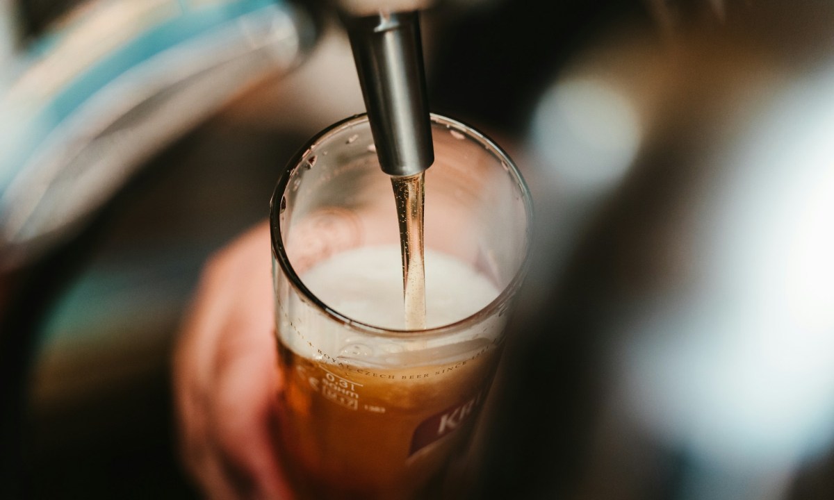 Pouring beer out of a tap