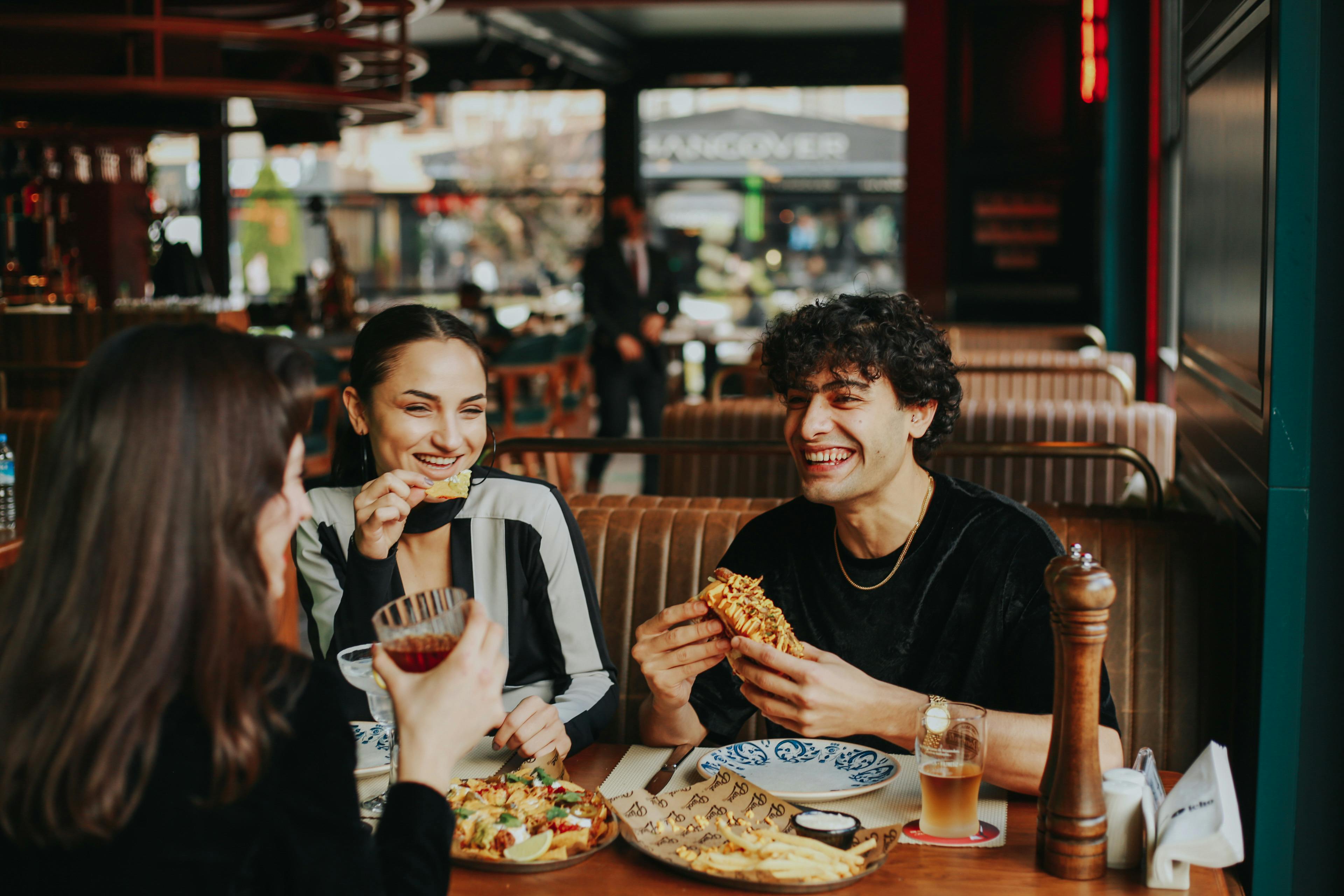 Friends sharing a meal in a restaurant