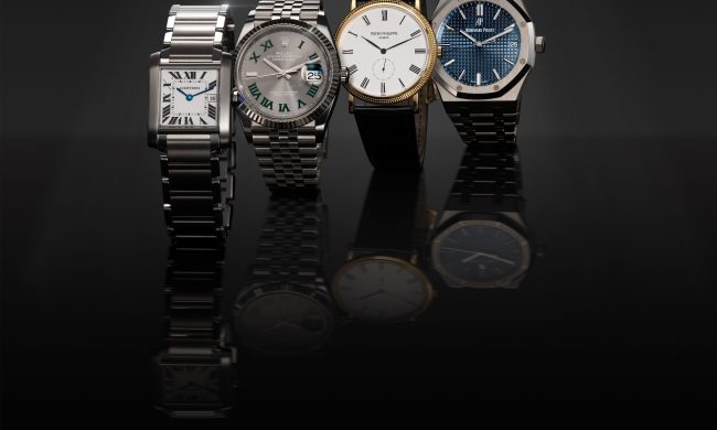 A row of four luxury watches.