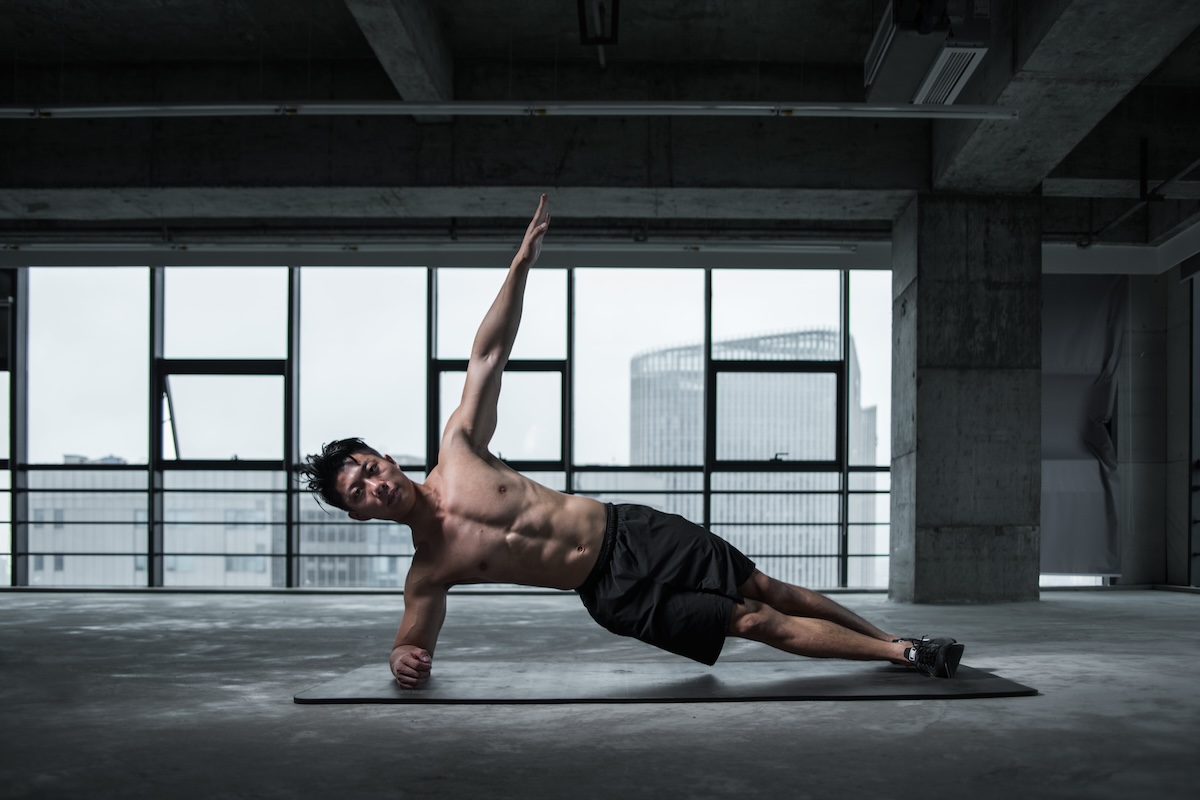 a man doing a side plank