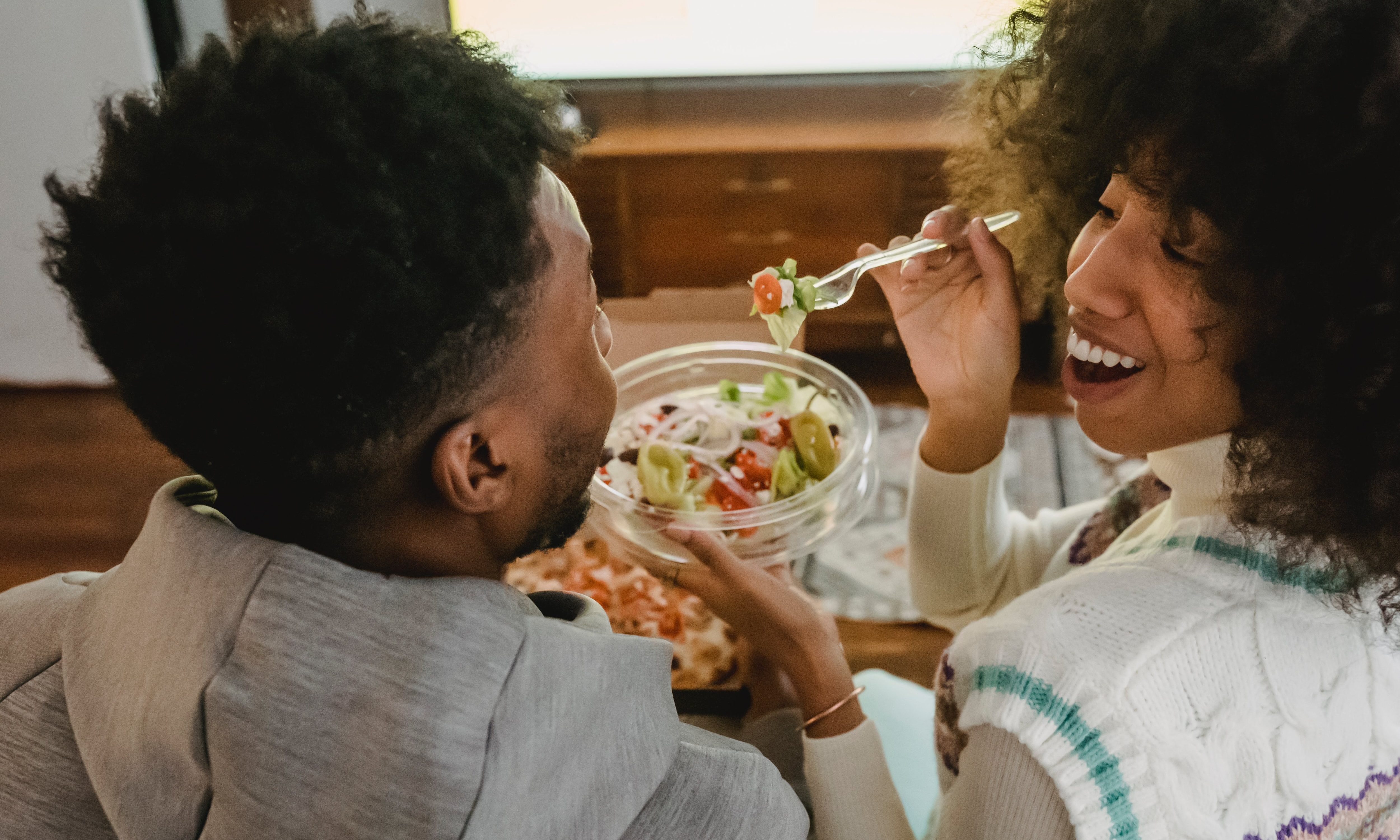 Man and women sharing a meal together