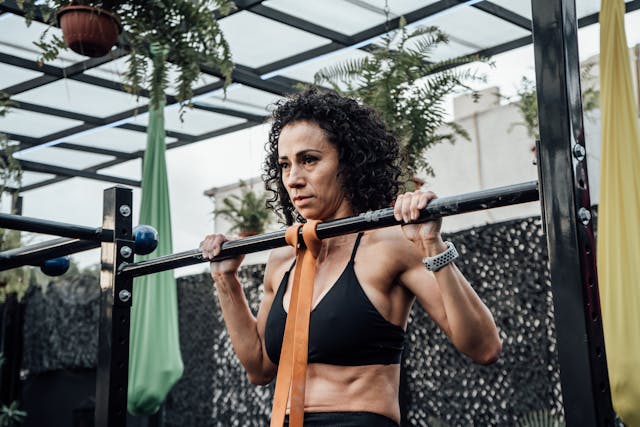 woman doing banded pull ups