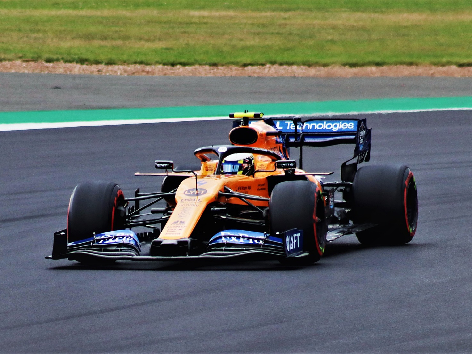 Lando Norris driving a McLaren F1 race car.