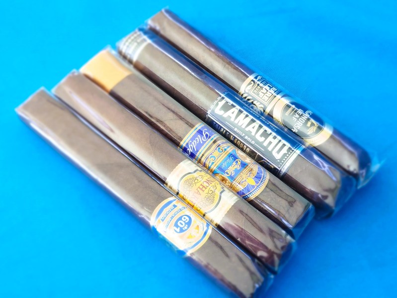 Maduro cigars in a lineup ready to smoke.