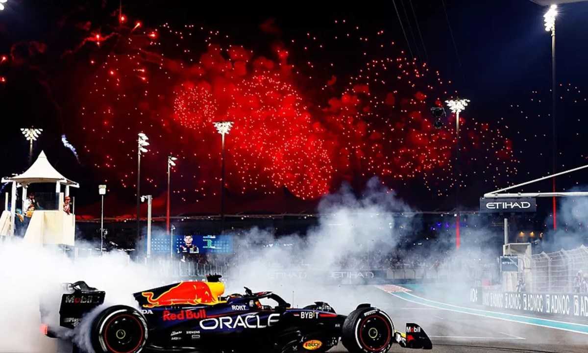 Red Bull's Max Verstappen driving a victory circle.