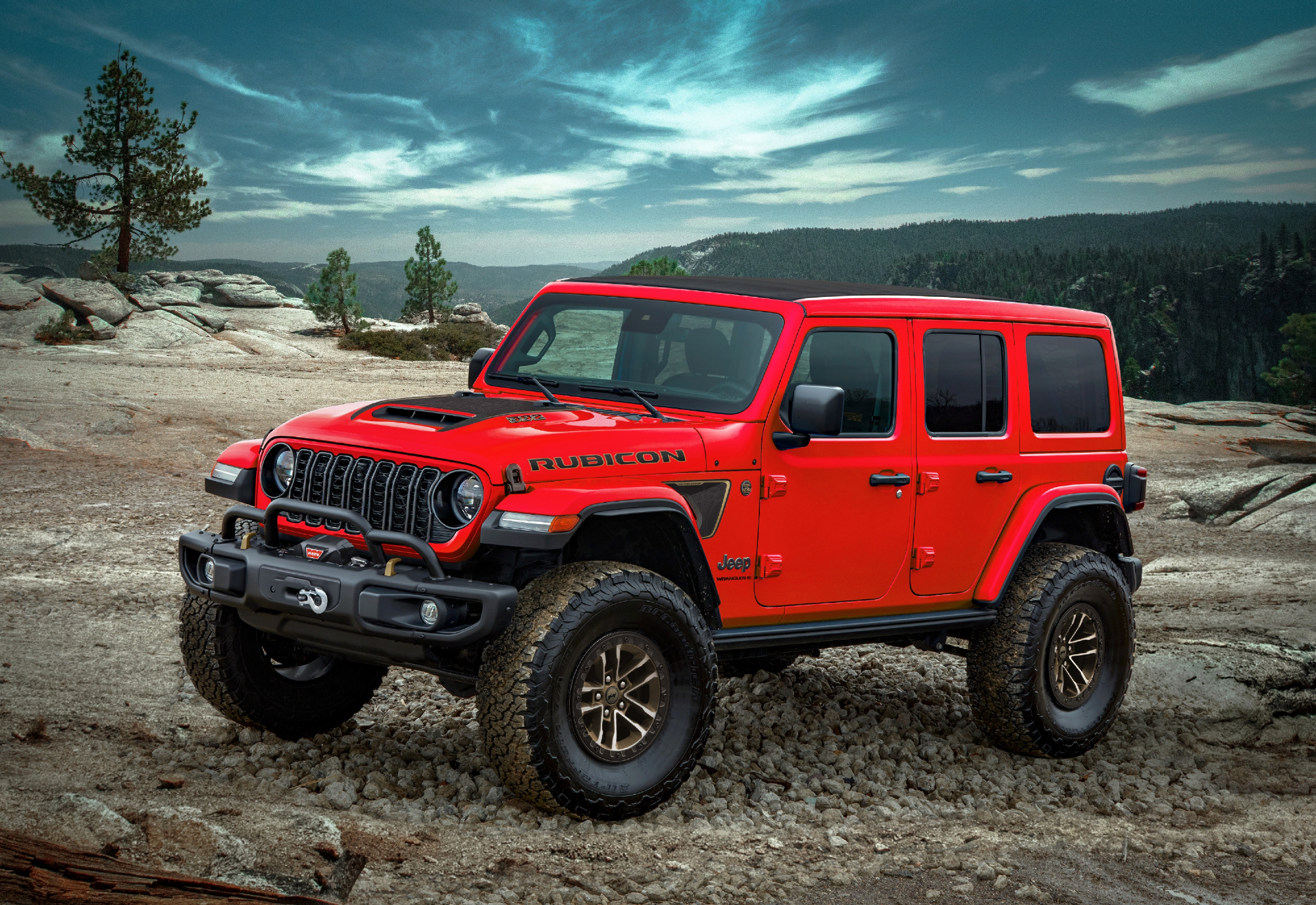 2024 Jeep Wrangler Rubicon 392 Final Edition parked on stone with the ocean in the background and stormy clouds.