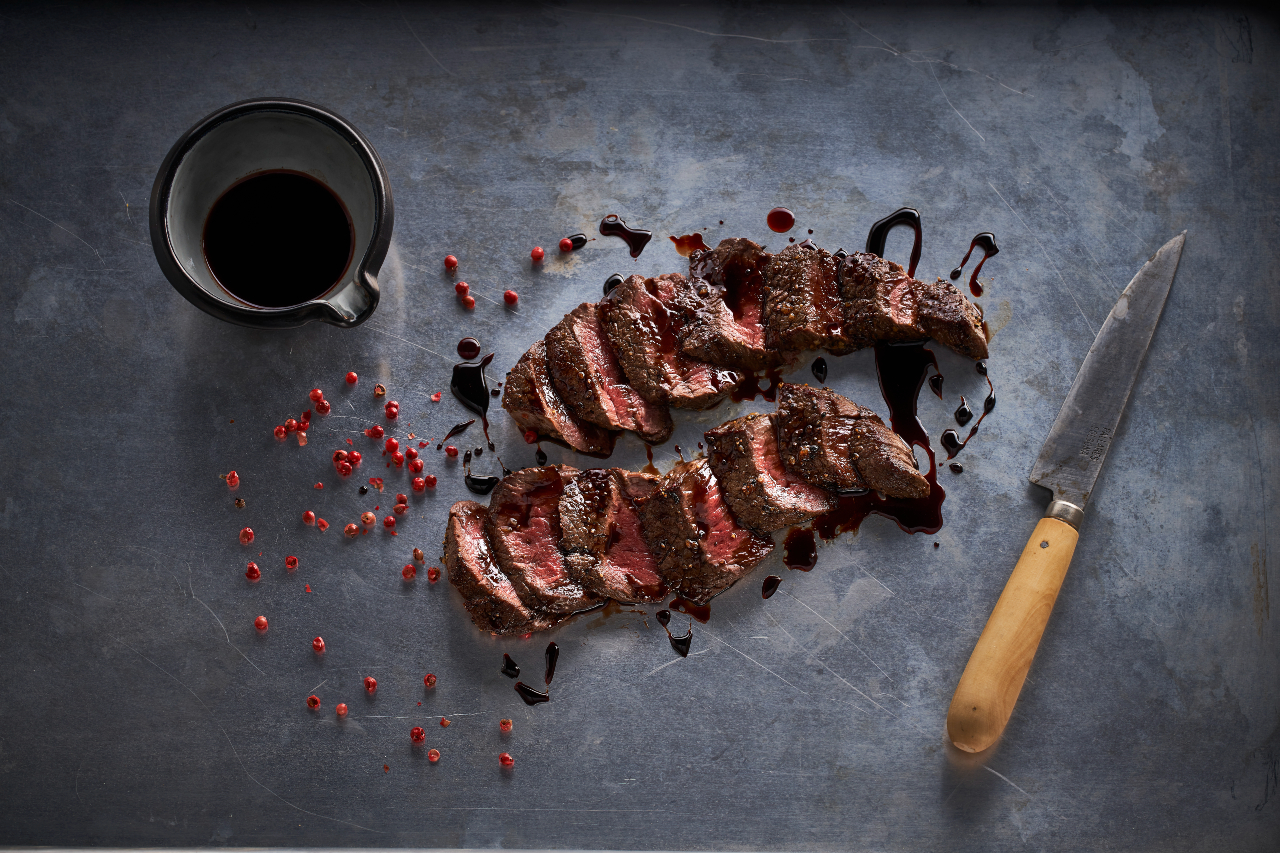 cooked elk with cup