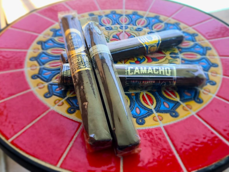 Maduro cigars on Spanish decorative tile table