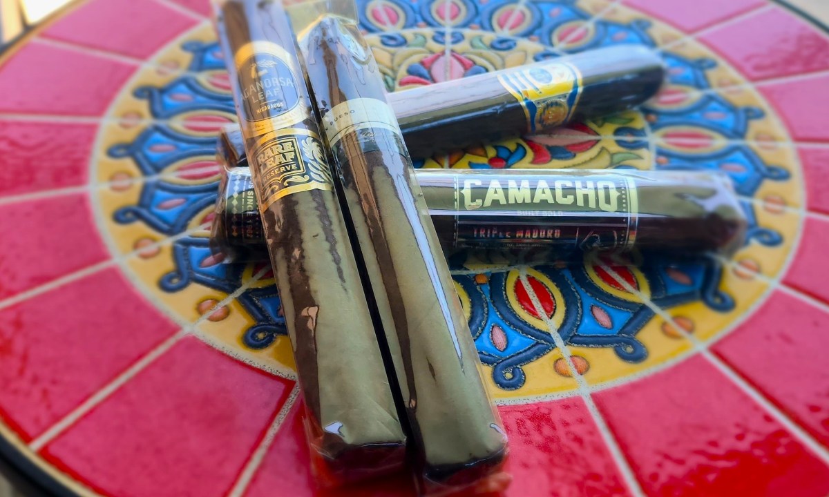 Maduro cigars on Spanish decorative tile table