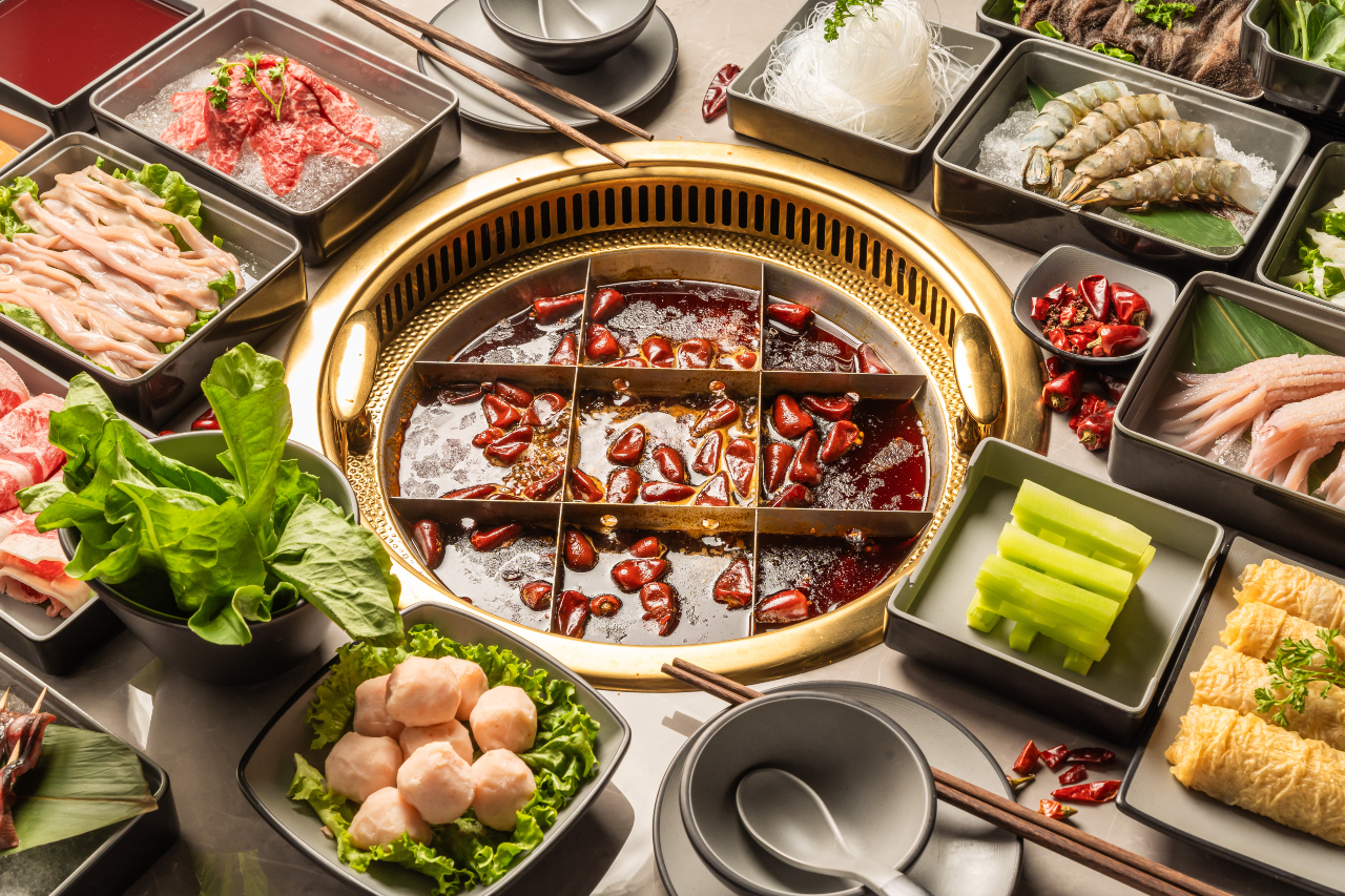 nine-grid hot pot with ingredients.