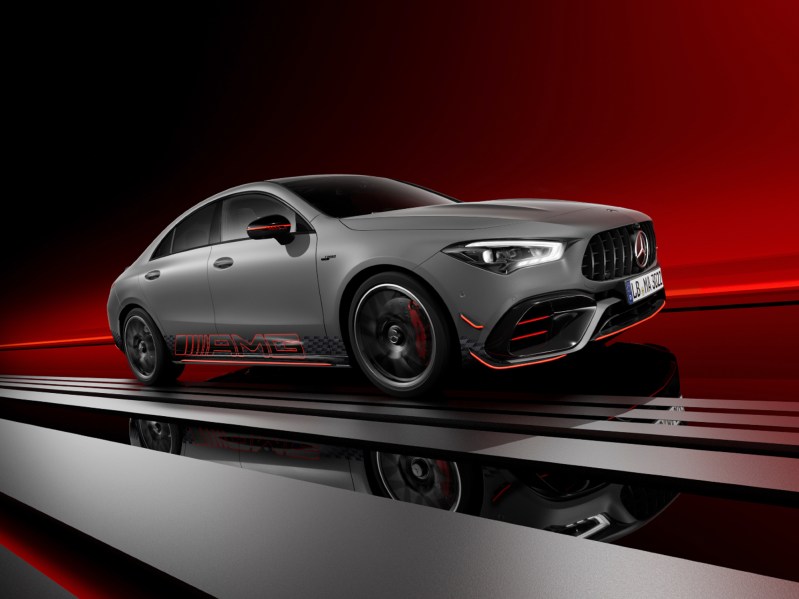 Mercedes-AMG CLA 45 S Edition 1 sedan parked on dark gray staging with a gradiant red background right front three quarter view