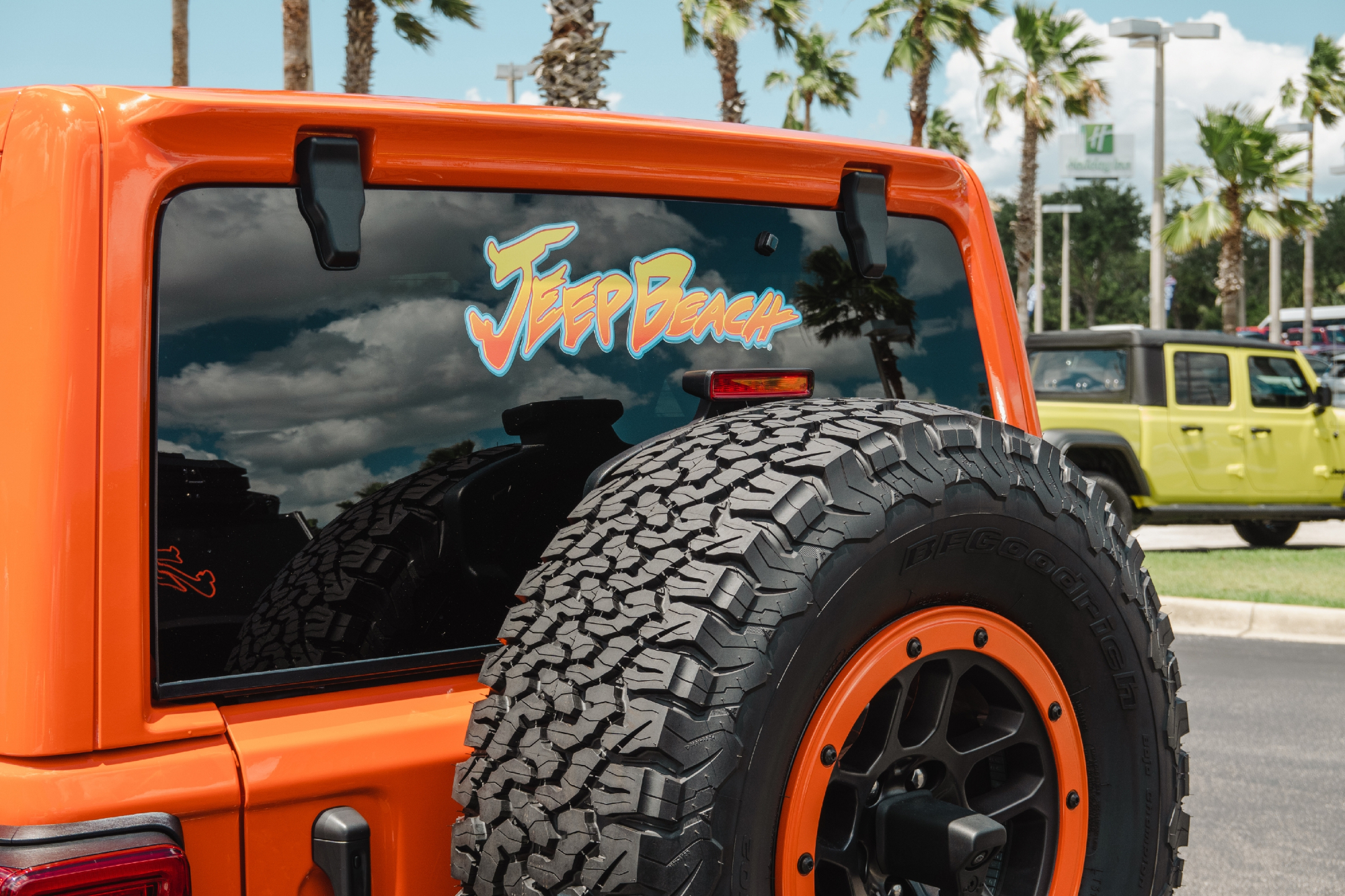 Photo from Jeep Beach Week 2023 of an the back of an orange Jeep Wrangler showing the Jeep Beach logo.