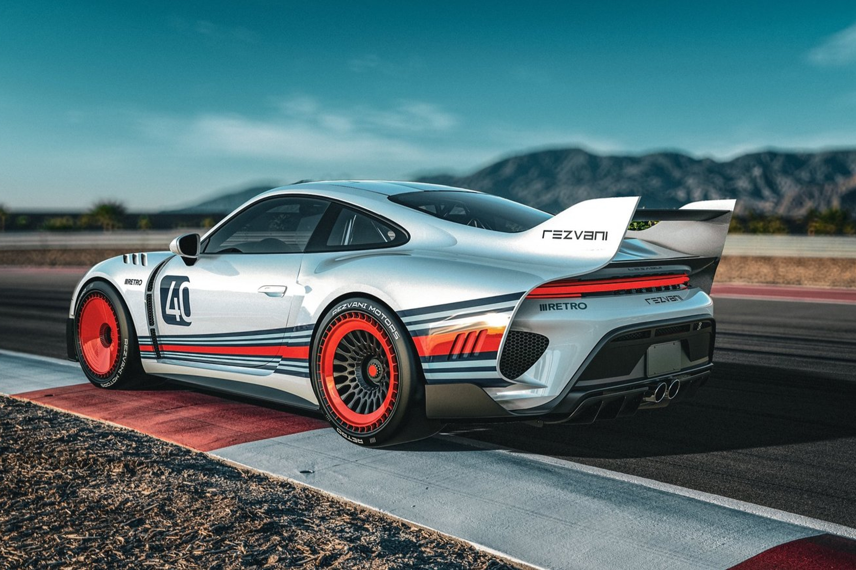 Rezvani Retro Porsche 911 conversion parked on tracksidewith a distant mountains in the background.