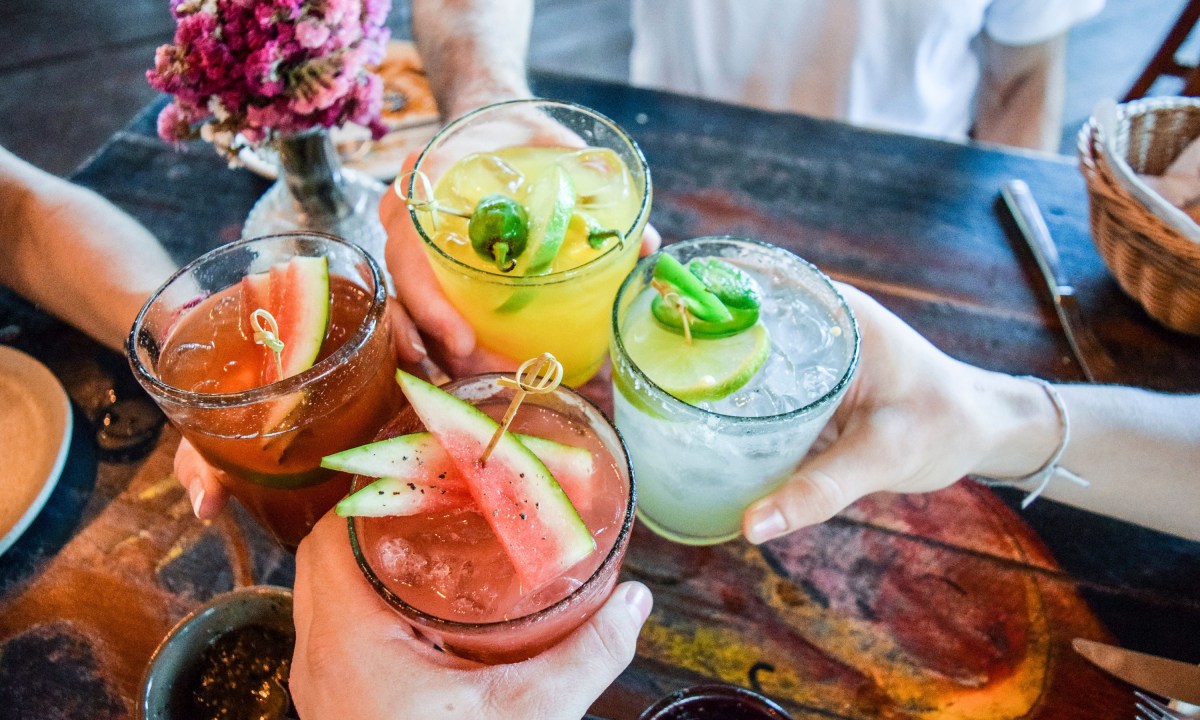 friends toasting with cocktails