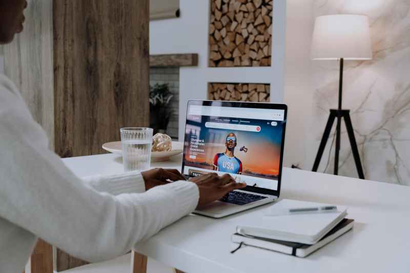 person booking an airbnb on computer